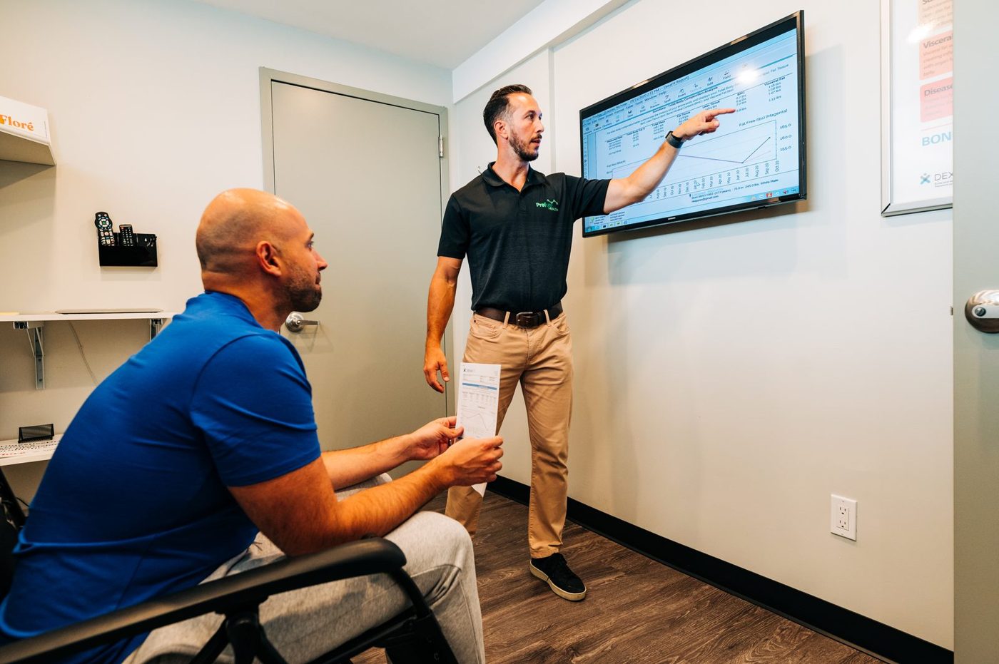 A Prefusion specialist walking a client through results on screen
