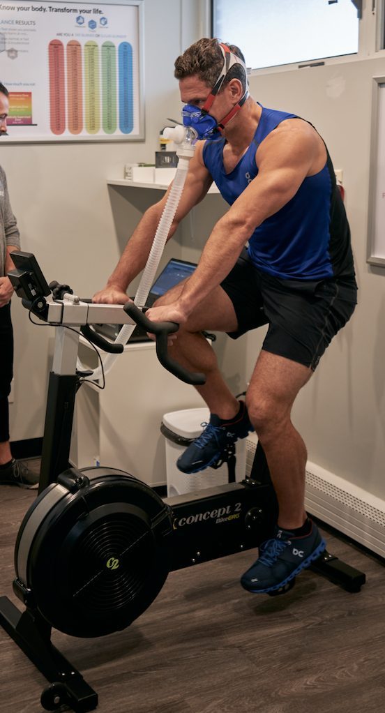 A coach guiding a client through a VO2 max test